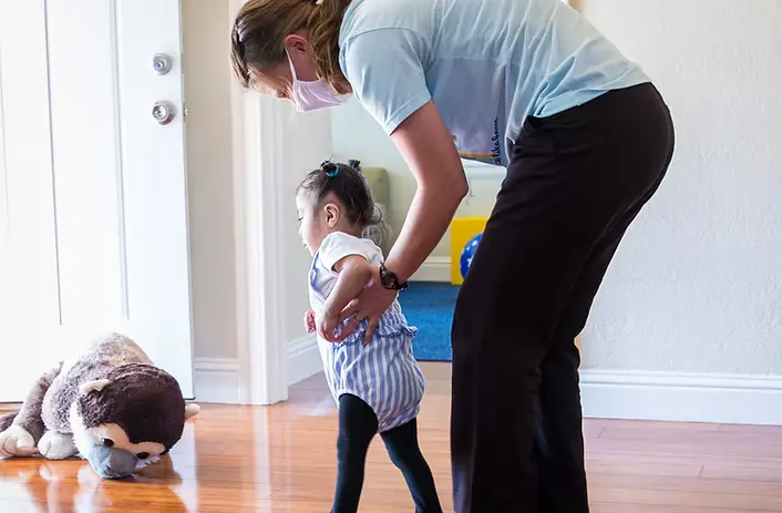 Pediatric home healthcare professional caring for a child